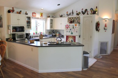 This open concept ranch style home on a slab is in a desirable - photo 5
