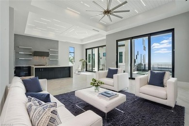 Panoramic Gulf and sand views define this elevated Gulf-front