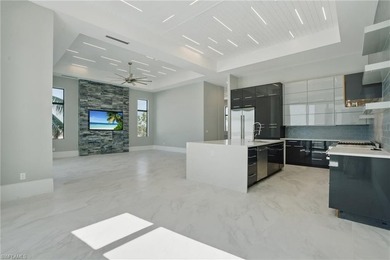 Panoramic Gulf and sand views define this elevated Gulf-front