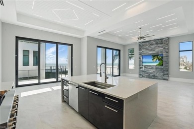 Panoramic Gulf and sand views define this elevated Gulf-front