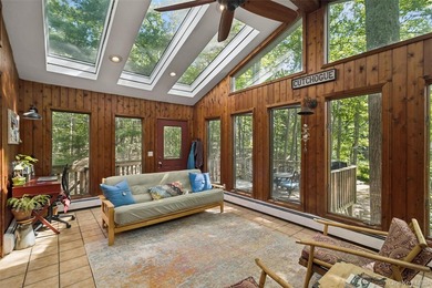 Tucked away among towering trees in the heart of Miller Place - photo 5