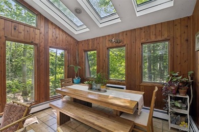 Tucked away among towering trees in the heart of Miller Place - photo 9