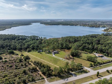 Privately positioned on Lake Mabel, this rare lakefront offering - photo 2