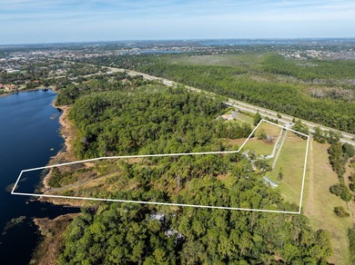 Privately positioned on Lake Mabel, this rare lakefront offering - photo 4