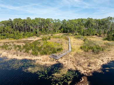 Privately positioned on Lake Mabel, this rare lakefront offering - photo 6