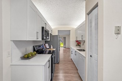 Beautifully renovated 2 BD, 2 BA first-floor condo in Century - photo 6