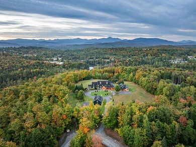 Set on 4.8 level acres w manicured lawns, this remarkable - photo 1
