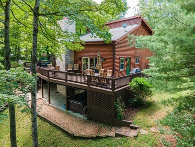This visually stunning, premier lakefront log home on a - photo 3