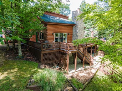 This visually stunning, premier lakefront log home on a - photo 5