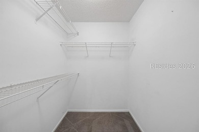 Enjoy wooded views from this second-floor condominium in The - photo 12