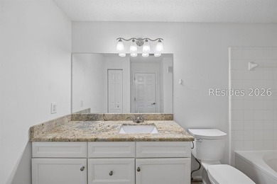 Enjoy wooded views from this second-floor condominium in The - photo 13