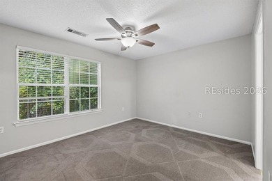 Enjoy wooded views from this second-floor condominium in The - photo 16