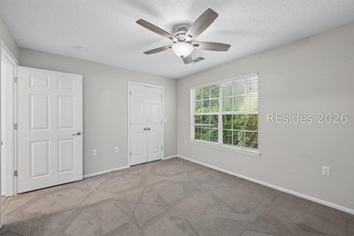 Enjoy wooded views from this second-floor condominium in The - photo 17
