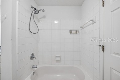 Enjoy wooded views from this second-floor condominium in The - photo 19