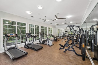 Enjoy wooded views from this second-floor condominium in The - photo 21
