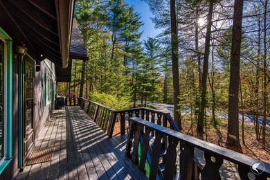 Nestled in a quiet wooded setting, this charming chalet-style - photo 6