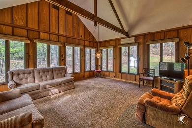 Nestled in a quiet wooded setting, this charming chalet-style - photo 7