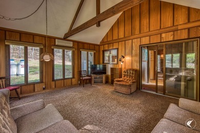 Nestled in a quiet wooded setting, this charming chalet-style - photo 8