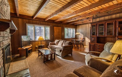 Nestled in a quiet wooded setting, this charming chalet-style - photo 10