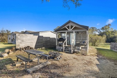Escape to the lake in this adorable 2023 tiny home located in - photo 1