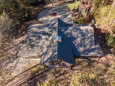 Discover a rare opportunity to own a stunning log home along the - photo 3