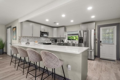 Completely remodeled 4-bed, 3-bath smart lakefront home on a - photo 6