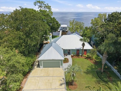 Beautifully remodeled coastal home featuring a private dock - photo 2