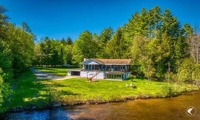 Set along the shoreline of Lower Saranac Lake within the - photo 2