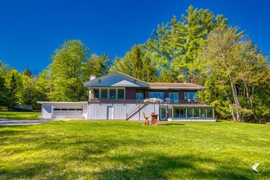 Set along the shoreline of Lower Saranac Lake within the - photo 5