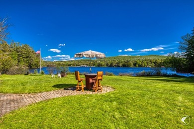 Set along the shoreline of Lower Saranac Lake within the - photo 7