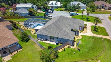 Nestled on a .54 acre corner cul-de-sac lot in the gated - photo 1