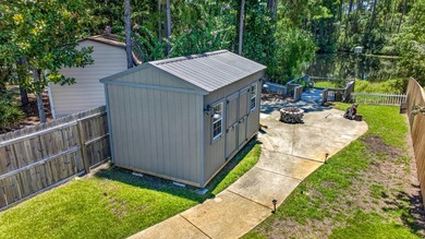 Nestled on a .54 acre corner cul-de-sac lot in the gated - photo 5