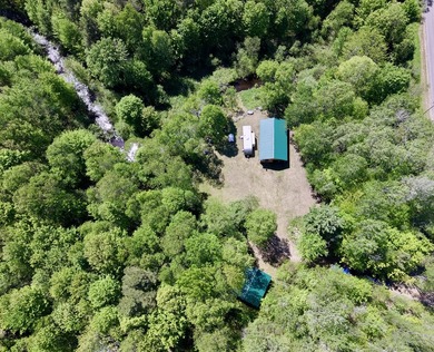 Set on 3.6 acres on Baker Rd, this unique property offers a - photo 1