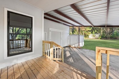 Nestled on a sprawling 0.68-acre parcel of unrestricted - photo 2
