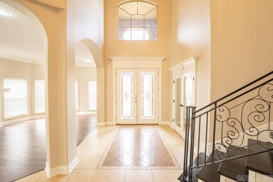 Oversized double entry doors open to a grand two-story foyer - photo 4