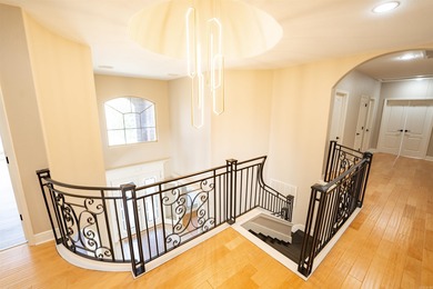 Oversized double entry doors open to a grand two-story foyer - photo 5