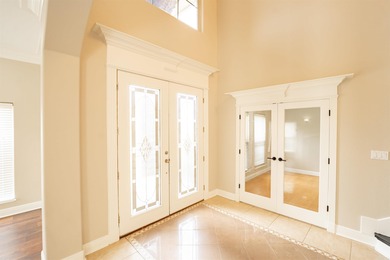 Oversized double entry doors open to a grand two-story foyer - photo 6