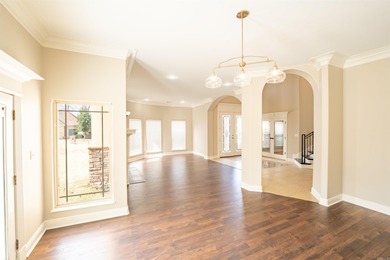 Oversized double entry doors open to a grand two-story foyer - photo 8