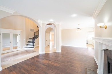 Oversized double entry doors open to a grand two-story foyer - photo 9