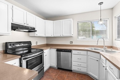 This charming three-bedroom, two-bathroom patio home is located - photo 12