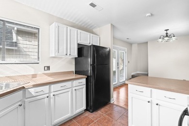 This charming three-bedroom, two-bathroom patio home is located - photo 14