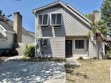 This charming three-bedroom, two-bathroom patio home is located - photo 17