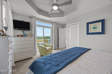 This meticulously maintained four-bedroom, three-bath waterfront