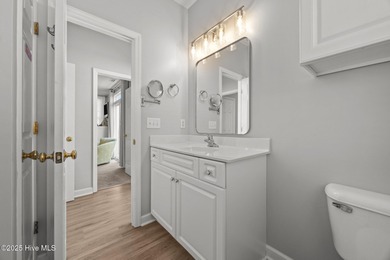 This meticulously maintained four-bedroom, three-bath waterfront