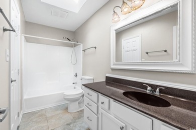 This charming three-bedroom, two-bathroom patio home is located - photo 26