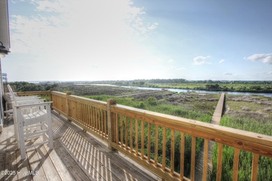 This meticulously maintained four-bedroom, three-bath waterfront