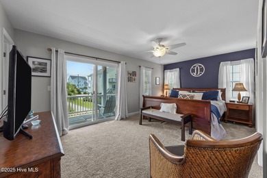 This meticulously maintained four-bedroom, three-bath waterfront