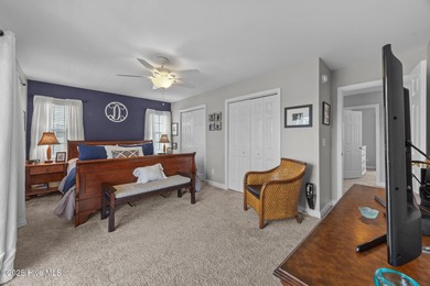 This meticulously maintained four-bedroom, three-bath waterfront