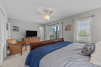 This meticulously maintained four-bedroom, three-bath waterfront