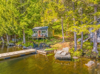 Set along approximately 150 feet of pristine shoreline on the - photo 1